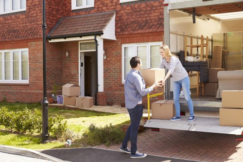 Professional local removals in Southharrow with a moving van outside a home