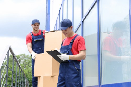 People organizing belongings with Southharrow storage in mind