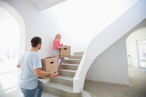 Worker handling boxed items safely in a storage unit