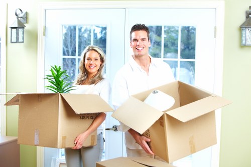 Stacked boxes and furniture representing South Harrow storage space